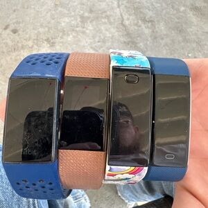 🔥 Lot of 4 Fitness Trackers – 1 Fitbit Charge 3 + 3 Generic Bands – AS‑IS